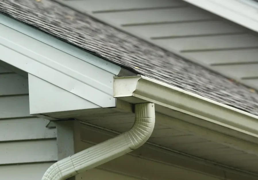 Close-up of roof shingles and gutter