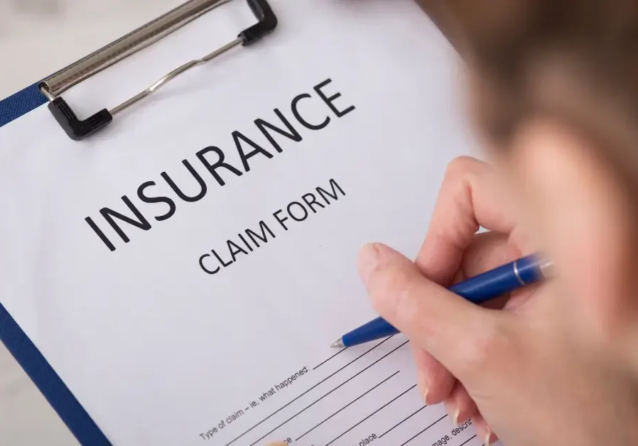 Insurance claim form on clipboard