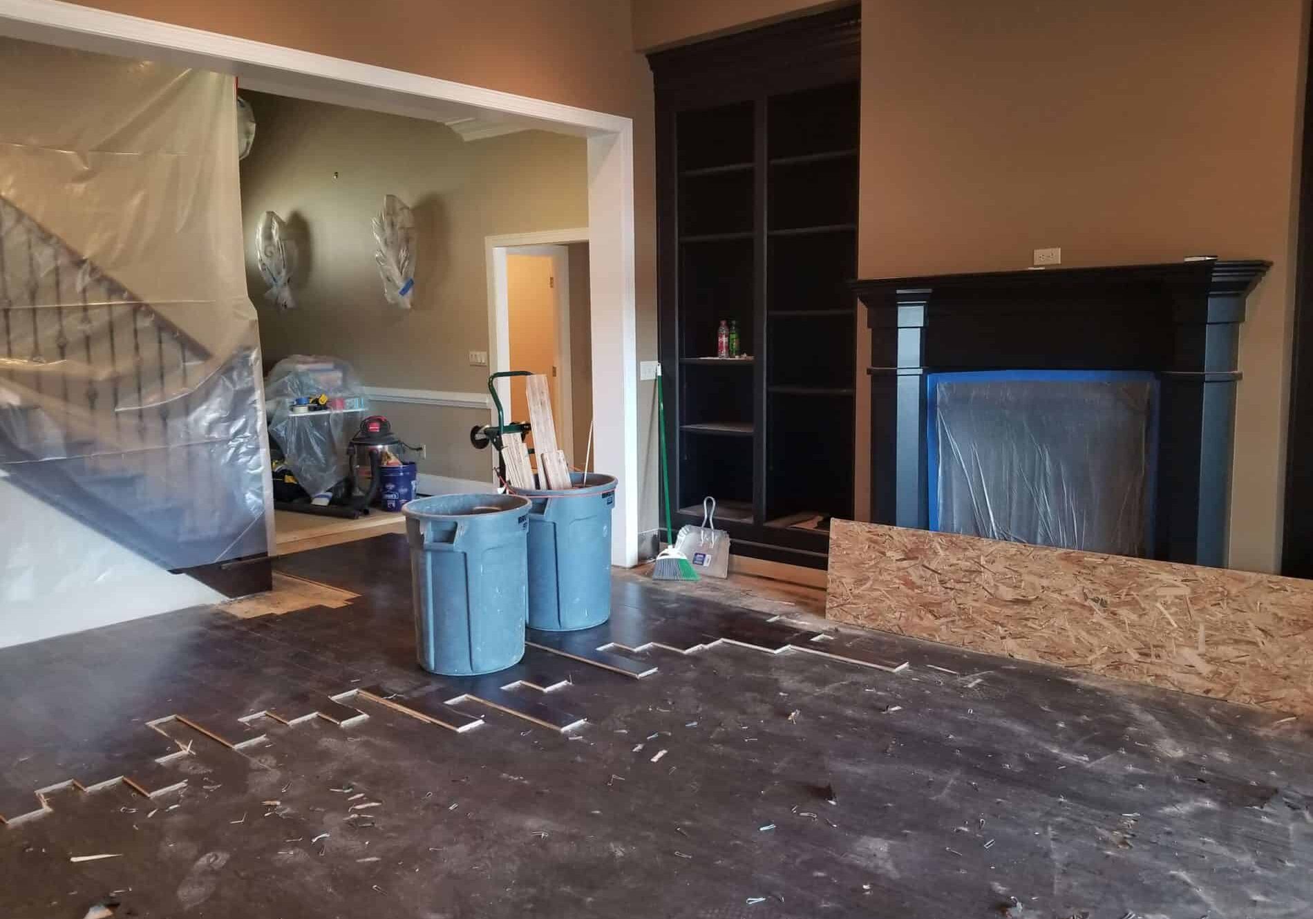 Living room under construction with tarps