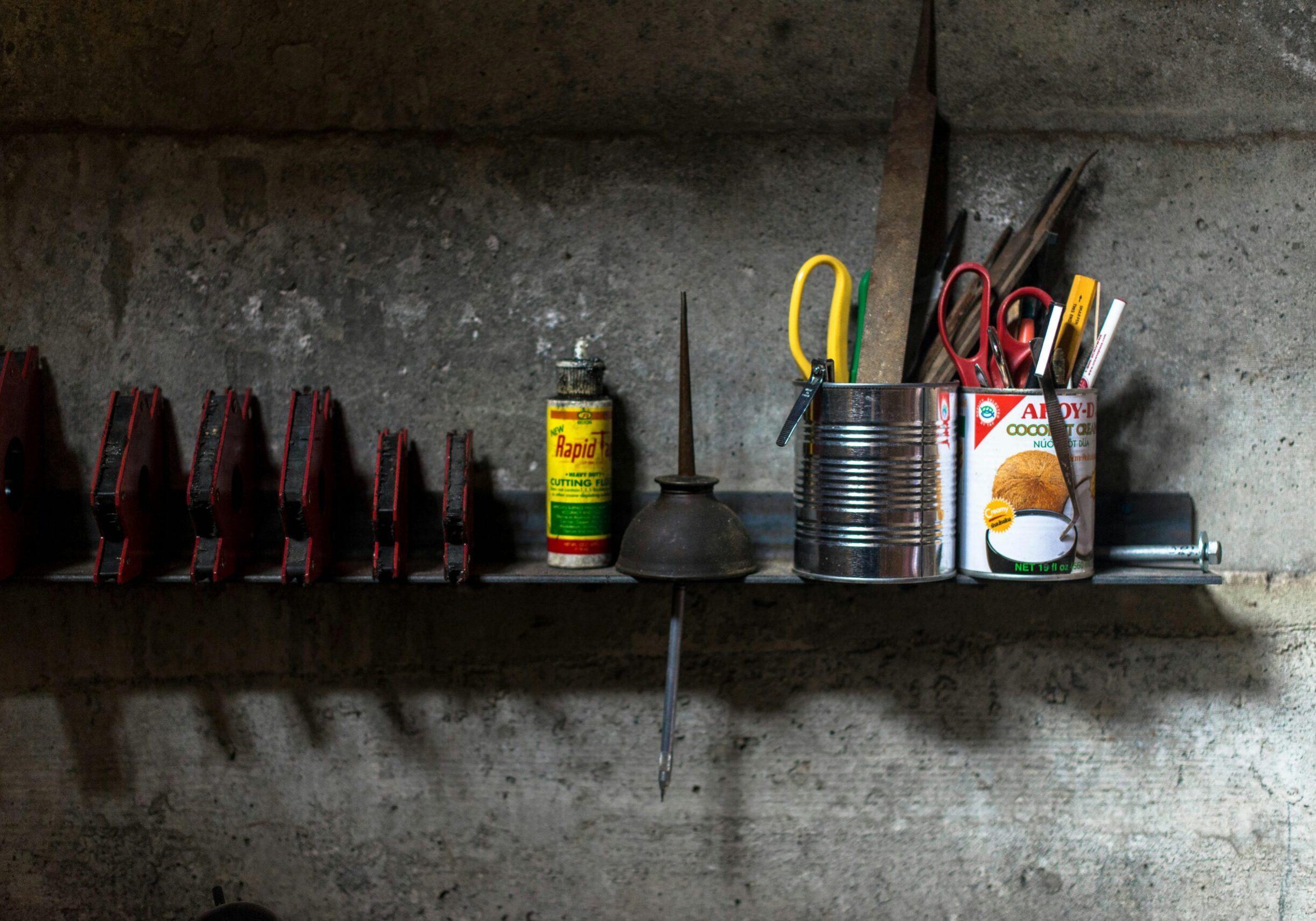 Workshop shelf with various supplies.